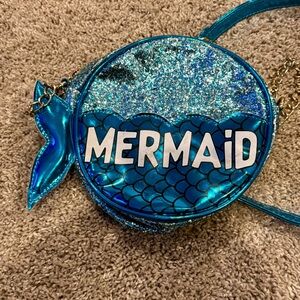 Super cute Olivia Miller round turquoise glitter mermaid purse.